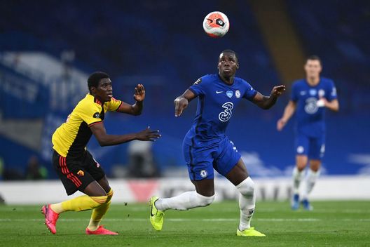 LONDON, ENGLAND - JULY 04: Kurt Zouma of Chelsea is challenged by Ismaila Sarr of Watford during the Premier League match between Chelsea FC and Watford FC at Stamford Bridge on July 04, 2020 in London, England. Football Stadiums around Europe remain empty due to the Coronavirus Pandemic as Government social distancing laws prohibit fans inside venues resulting in all fixtures being played behind closed doors. (Photo by Darren Walsh/Chelsea FC via Getty Images) LONDON, ENGLAND - JULY 04: Kurt Zouma of Chelsea is challenged by Ismaila Sarr of Watford during the Premier League match between Chelsea FC and Watford FC at Stamford Bridge on July 04, 2020 in London, England. Football Stadiums around Europe remain empty due to the Coronavirus Pandemic as Government social distancing laws prohibit fans inside venues resulting in all fixtures being played behind closed doors. (Photo by Darren Walsh/Chelsea FC via Getty Images)