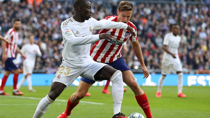 MADRID, SPAIN - FEBRUARY 01: Ferland Mendy of Real Madrid is challenged by Marcos Llorente of Atletico de Madrid during the Liga match between Real Madrid CF and Club Atletico de Madrid at Estadio Santiago Bernabeu on February 01, 2020 in Madrid, Spain. (Photo by Angel Martinez/Getty Images) MADRID, SPAIN - FEBRUARY 01: Ferland Mendy of Real Madrid is challenged by Marcos Llorente of Atletico de Madrid during the Liga match between Real Madrid CF and Club Atletico de Madrid at Estadio Santiago Bernabeu on February 01, 2020 in Madrid, Spain. (Photo by Angel Martinez/Getty Images)