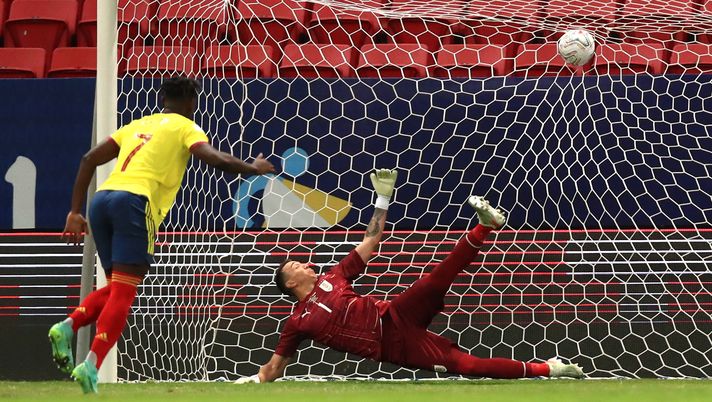 BRASILIA, BRAZIL - JULY 03: Duvan Zapata of Colombia scores his penalty kick against Fernando Muslera of Uruguay during a shootout after a quarter-final match of Copa America Brazil 2021 between Colombia and Uruguay at Mane Garrincha Stadium on July 03, 2021 in Brasilia, Brazil. (Photo by Buda Mendes/Getty Images) BRASILIA, BRAZIL - JULY 03: Duvan Zapata of Colombia scores his penalty kick against Fernando Muslera of Uruguay during a shootout after a quarter-final match of Copa America Brazil 2021 between Colombia and Uruguay at Mane Garrincha Stadium on July 03, 2021 in Brasilia, Brazil. (Photo by Buda Mendes/Getty Images)