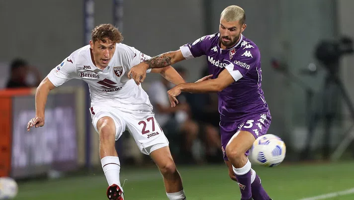 FLORENCE, ITALY - SEPTEMBER 19: Mercim Vojvoda of Torino FC in action against Patrick Cutrone of ACF Fiorentina during the Serie A match between ACF Fiorentina and Torino FC at Stadio Artemio Franchi on September 19, 2020 in Florence, Italy.  (Photo by Gabriele Maltinti/Getty Images)