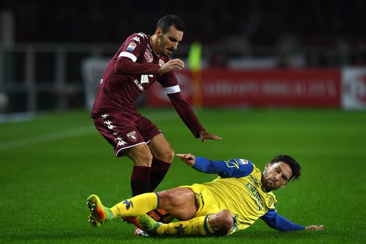TURIN, ITALY - NOVEMBER 26: Davide Zappacosta (L) of FC Torino is tackled by Lucas Nahuel Castro of AC ChievoVerona during the Serie A match between FC Torino and AC ChievoVerona at Stadio Olimpico di Torino on November 26, 2016 in Turin, Italy. (Photo by Valerio Pennicino/Getty Images) TURIN, ITALY - NOVEMBER 26: Davide Zappacosta (L) of FC Torino is tackled by Lucas Nahuel Castro of AC ChievoVerona during the Serie A match between FC Torino and AC ChievoVerona at Stadio Olimpico di Torino on November 26, 2016 in Turin, Italy. (Photo by Valerio Pennicino/Getty Images)