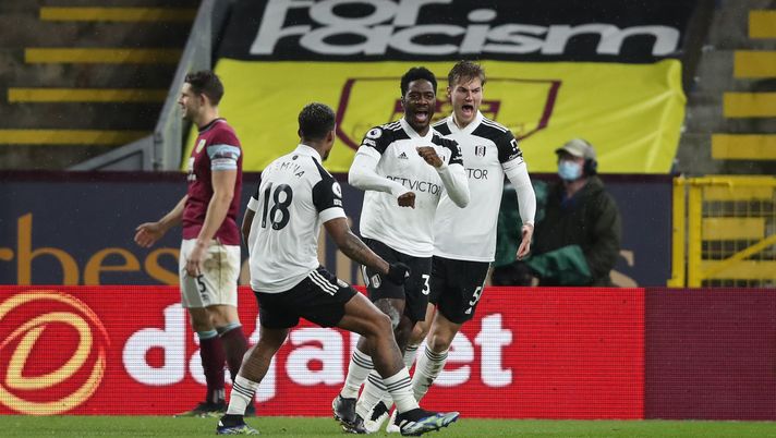 BURNLEY, ENGLAND - FEBRUARY 17: Ola Aina of Fulham celebrates with Mario Lemina and Joachim Andersen after scoring his team's first goal during the Premier League match between Burnley and Fulham at Turf Moor on February 17, 2021 in Burnley, England. Sporting stadiums around the UK remain under strict restrictions due to the Coronavirus Pandemic as Government social distancing laws prohibit fans inside venues resulting in games being played behind closed doors. (Photo by Clive Brunskill/Getty Images) BURNLEY, ENGLAND - FEBRUARY 17: Ola Aina of Fulham celebrates with Mario Lemina and Joachim Andersen after scoring his team's first goal during the Premier League match between Burnley and Fulham at Turf Moor on February 17, 2021 in Burnley, England. Sporting stadiums around the UK remain under strict restrictions due to the Coronavirus Pandemic as Government social distancing laws prohibit fans inside venues resulting in games being played behind closed doors. (Photo by Clive Brunskill/Getty Images)