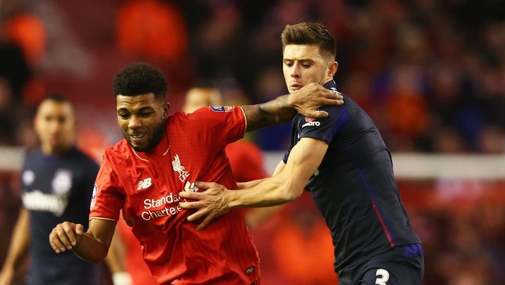 LIVERPOOL, ENGLAND - JANUARY 30:  Jerome Sinclair of Liverpoo holds off Aaron Cresswell of West Ham United during the Emirates FA Cup Fourth Round match between Liverpool and West Ham United at Anfield on January 30, 2016 in Liverpool, England.  (Photo by Clive Brunskill/Getty Images) 