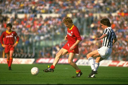 1986: Zbigniew Boniek (left) of Roma gets away from Manfredonia of Juventus during a Serie A match at the Olympic Stadium in Rome. Roma won the match 3-0. Mandatory Credit: Allsport UK /Allsport 1986: Zbigniew Boniek (left) of Roma gets away from Manfredonia of Juventus during a Serie A match at the Olympic Stadium in Rome. Roma won the match 3-0. Mandatory Credit: Allsport UK /Allsport