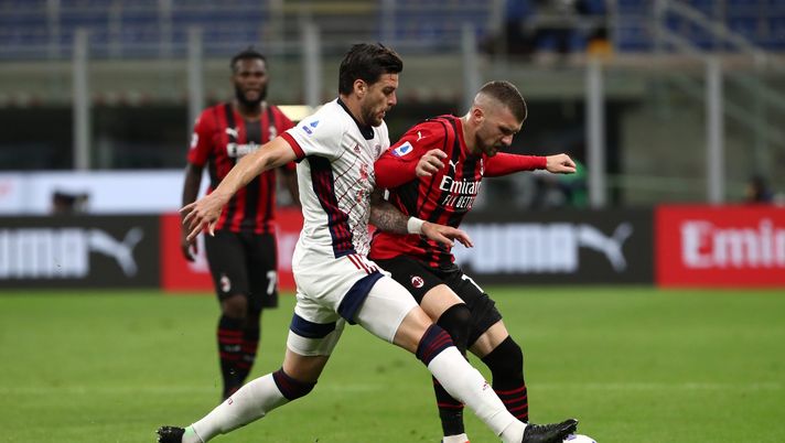MILAN, ITALY - MAY 16: Luca Ceppitelli of Cagliari Calcio battles for possession with Ante Rebic of A.C. Milan during the Serie A match between AC Milan and Cagliari Calcio at Stadio Giuseppe Meazza on May 16, 2021 in Milan, Italy. Sporting stadiums around Italy remain under strict restrictions due to the Coronavirus Pandemic as Government social distancing laws prohibit fans inside venues resulting in games being played behind closed doors. (Photo by Marco Luzzani/Getty Images) MILAN, ITALY - MAY 16: Luca Ceppitelli of Cagliari Calcio battles for possession with Ante Rebic of A.C. Milan during the Serie A match between AC Milan and Cagliari Calcio at Stadio Giuseppe Meazza on May 16, 2021 in Milan, Italy. Sporting stadiums around Italy remain under strict restrictions due to the Coronavirus Pandemic as Government social distancing laws prohibit fans inside venues resulting in games being played behind closed doors. (Photo by Marco Luzzani/Getty Images)