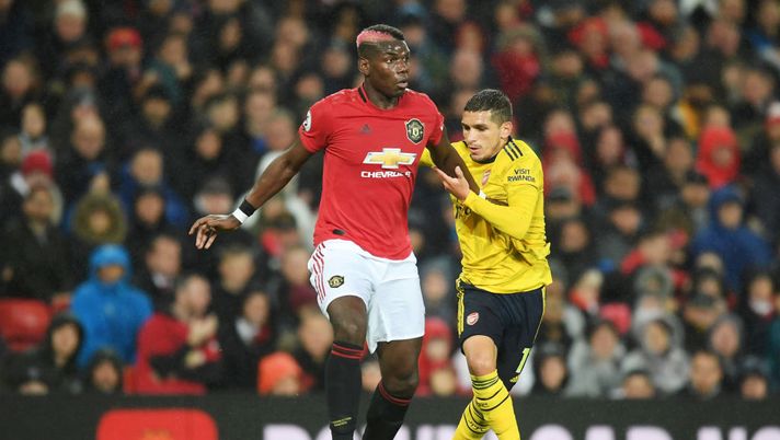 MANCHESTER, ENGLAND - SEPTEMBER 30: Paul Pogba of Manchester United battles for possession with Lucas Torreira of Arsenal during the Premier League match between Manchester United and Arsenal FC at Old Trafford on September 30, 2019 in Manchester, United Kingdom. (Photo by Michael Regan/Getty Images) MANCHESTER, ENGLAND - SEPTEMBER 30: Paul Pogba of Manchester United battles for possession with Lucas Torreira of Arsenal during the Premier League match between Manchester United and Arsenal FC at Old Trafford on September 30, 2019 in Manchester, United Kingdom. (Photo by Michael Regan/Getty Images)