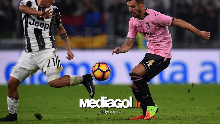 TURIN, ITALY - FEBRUARY 17: Paulo Dybala (L) of Juventus controls the ball as Sinisa Andelkovic of Palermo tackles during the Serie A match between Juventus FC and US Citta di Palermo at Juventus Stadium on February 17, 2017 in Turin, Italy.  (Photo by Tullio M. Puglia/Getty Images)  palermo