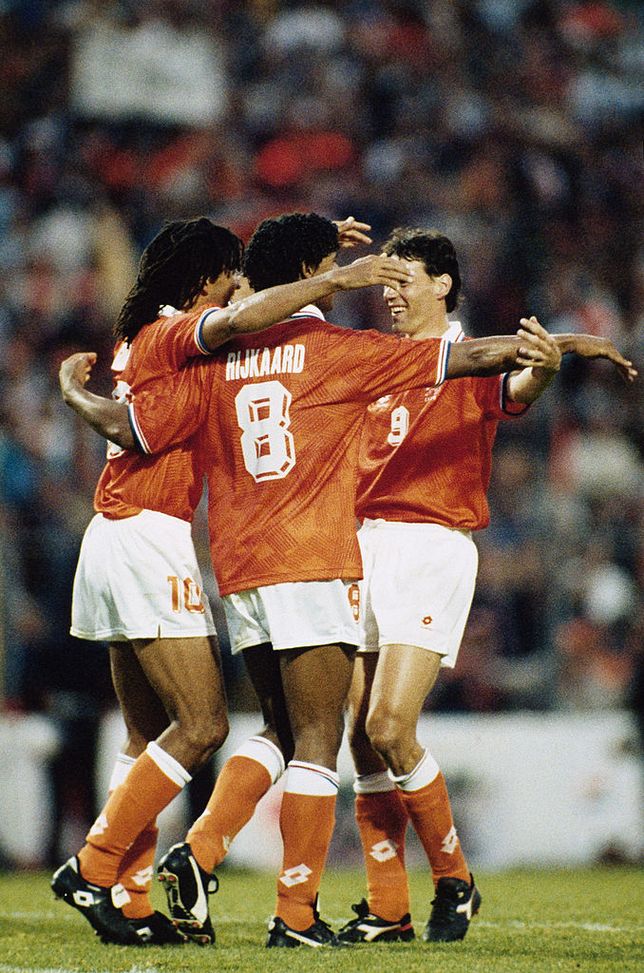 GOTHENBURG, SWEDEN - JUNE 18: The AC Milan contingent of Ruud Gullit, Frank Rijkaard and Marco van Basten of Netherlands celebrate a famous victory at full time during the UEFA European Championships 1992 Group 2 match between Netherlands and Germany held at the Ullevi Stadium on June 18, 1992 in Gothenburg, Sweden. (Photo by Simon Bruty/Allsport/Getty Images)