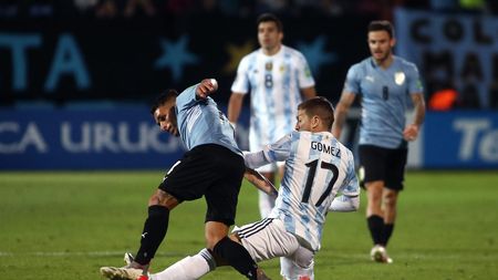 MONTEVIDEO, URUGUAY - NOVEMBER 12: Lucas Torreira of Uruguay fights for the ball with Alejandro Gómez of Argentina during a match between Uruguay and Argentina as part of FIFA World Cup Qatar 2022 Qualifiers at Campeón del Siglo Stadium on November 12, 2021 in Montevideo, Uruguay. (Photo by Ernesto Ryan/Getty Images) MONTEVIDEO, URUGUAY - NOVEMBER 12: Lucas Torreira of Uruguay fights for the ball with Alejandro Gómez of Argentina during a match between Uruguay and Argentina as part of FIFA World Cup Qatar 2022 Qualifiers at Campeón del Siglo Stadium on November 12, 2021 in Montevideo, Uruguay. (Photo by Ernesto Ryan/Getty Images)