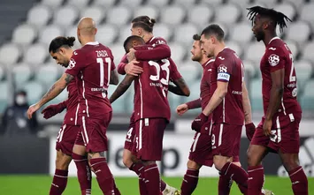  TURIN, ITALY - DECEMBER 05: Nkoulou Nicolas of Torino FC celebrates with teammate Lyanco Vojnovic after scoring his team's first goal after scoring his team's first goal during the Serie A match between Juventus and Torino FC at Allianz Stadium on December 05, 2020 in Turin, Italy. Football Stadiums around Italy remain empty due to the Coronavirus Pandemic as Government social distancing laws prohibit fans inside venues resulting in fixtures being played behind closed doors. (Photo by Valerio Pennicino/Getty Images)