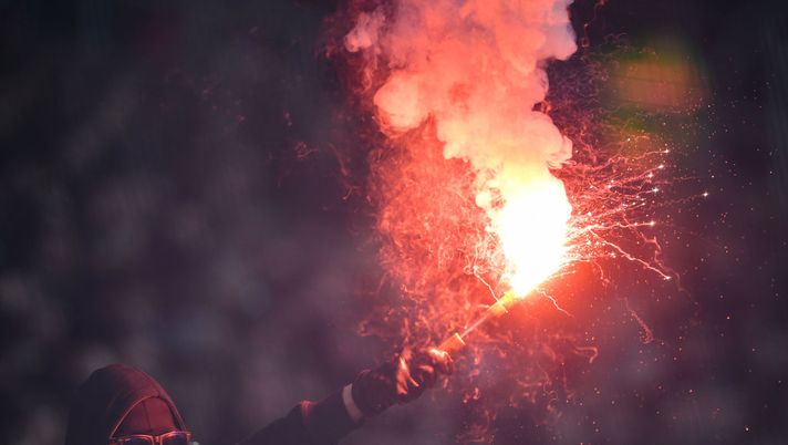HAMBURG, GERMANY - FEBRUARY 01: A fan of Stuttgart holds a flare during the Second Bundesliga match between FC St. Pauli and VfB Stuttgart at Millerntor Stadium on February 01, 2020 in Hamburg, Germany. (Photo by Stuart Franklin/Bongarts/Getty Images) HAMBURG, GERMANY - FEBRUARY 01: A fan of Stuttgart holds a flare during the Second Bundesliga match between FC St. Pauli and VfB Stuttgart at Millerntor Stadium on February 01, 2020 in Hamburg, Germany. (Photo by Stuart Franklin/Bongarts/Getty Images)