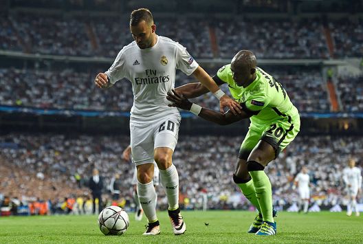  Jese of Real Madrid is challenged by Eliaquim Mangala of Manchester City 