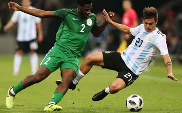  KRASNODAR, RUSSIA - NOVEMBER 14: Paulo Dybala of Argentina fights for the ball with Ola Aina of Nigeria during an international friendly match between Argentina and Nigeria at Krasnodar Stadium on November 14, 2017 in Krasnodar, Russia. (Photo by Oleg Nikishin/Getty Images)