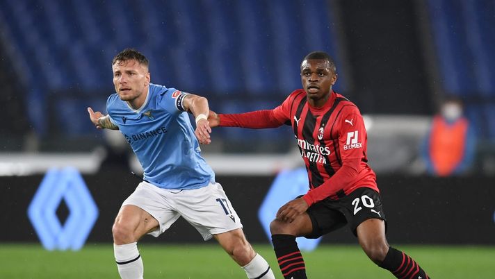 ROME, ITALY - APRIL 24: Pierre Kalulu of AC Milan competes for the ball with Ciro Immobile of SS Lazio during the Serie A match between SS Lazio and AC Milan at Stadio Olimpico on April 24, 2022 in Rome, Italy. (Photo by Claudio Villa/AC Milan via Getty Images)