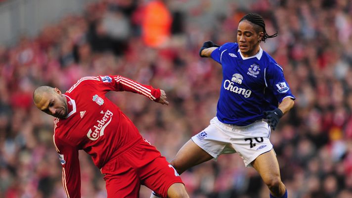LIVERPOOL, UNITED KINGDOM - JANUARY 25: Andrea Dossena of Liverpool is challenged by Steven Pienaar of Everton during the FA Cup sponsored by E.ON Fourth Round match between Liverpool and Everton at Anfield on January 25, 2009 in Liverpool, England. (Photo by Mike Hewitt/Getty Images) LIVERPOOL, UNITED KINGDOM - JANUARY 25: Andrea Dossena of Liverpool is challenged by Steven Pienaar of Everton during the FA Cup sponsored by E.ON Fourth Round match between Liverpool and Everton at Anfield on January 25, 2009 in Liverpool, England. (Photo by Mike Hewitt/Getty Images)
