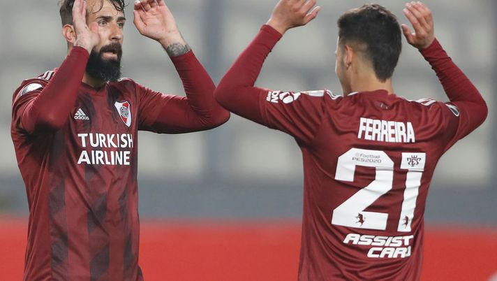 LIMA, PERU - SEPTEMBER 22: Lucas Pratto of River Plate celebrates after scoring the sixth goal of his team with Cristian Ferreira during a group D match of Copa CONMEBOL Libertadores 2020 between Binacional and River Plate at Estadio Nacional de Lima on September 22, 2020 in Lima, Peru. (Photo by Paolo Aguilar - Pool/Getty Images) LIMA, PERU - SEPTEMBER 22: Lucas Pratto of River Plate celebrates after scoring the sixth goal of his team with Cristian Ferreira during a group D match of Copa CONMEBOL Libertadores 2020 between Binacional and River Plate at Estadio Nacional de Lima on September 22, 2020 in Lima, Peru. (Photo by Paolo Aguilar - Pool/Getty Images)