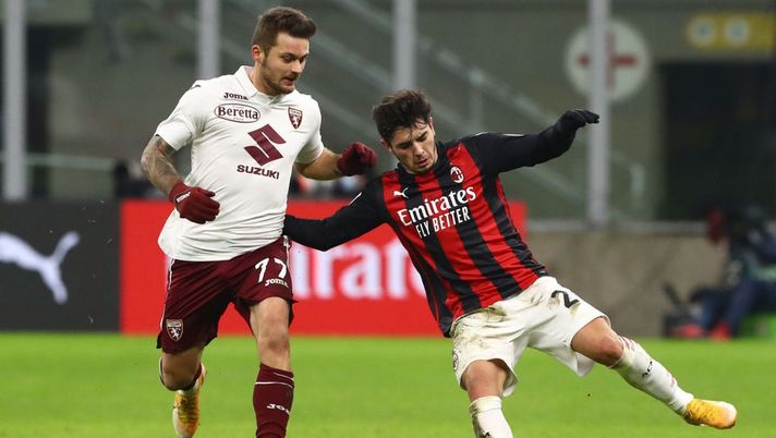 MILAN, ITALY - JANUARY 12: Brahim Diaz of A.C. Milan is challenged by Karol Linetty of Torino F.C. during the Coppa Italia match between AC Milan and Torino FC at Stadio Giuseppe Meazza on January 12, 2021 in Milan, Italy. Sporting stadiums around Italy remain under strict restrictions due to the Coronavirus Pandemic as Government social distancing laws prohibit fans inside venues resulting in games being played behind closed doors. (Photo by Marco Luzzani/Getty Images) MILAN, ITALY - JANUARY 12: Brahim Diaz of A.C. Milan is challenged by Karol Linetty of Torino F.C. during the Coppa Italia match between AC Milan and Torino FC at Stadio Giuseppe Meazza on January 12, 2021 in Milan, Italy. Sporting stadiums around Italy remain under strict restrictions due to the Coronavirus Pandemic as Government social distancing laws prohibit fans inside venues resulting in games being played behind closed doors. (Photo by Marco Luzzani/Getty Images)