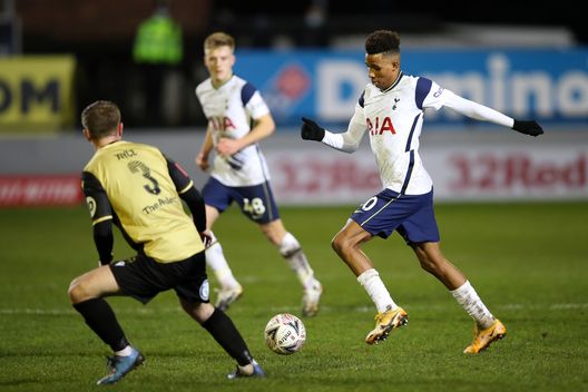 CROSBY, ENGLAND - JANUARY 10: Gedson Fernandes of Tottenham Hotspur controls the ball under pressure from James Joyce of Marine during the FA Cup Third Round match between Marine and Tottenham Hotspur at Rossett Park on January 10, 2021 in Crosby, England. Sporting stadiums around England remain under strict restrictions due to the Coronavirus Pandemic as Government social distancing laws prohibit fans inside venues resulting in games being played behind closed doors. (Photo by Clive Brunskill/Getty Images) CROSBY, ENGLAND - JANUARY 10: Gedson Fernandes of Tottenham Hotspur controls the ball under pressure from James Joyce of Marine during the FA Cup Third Round match between Marine and Tottenham Hotspur at Rossett Park on January 10, 2021 in Crosby, England. Sporting stadiums around England remain under strict restrictions due to the Coronavirus Pandemic as Government social distancing laws prohibit fans inside venues resulting in games being played behind closed doors. (Photo by Clive Brunskill/Getty Images)