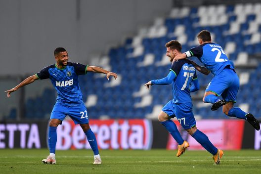 REGGIO NELL'EMILIA, ITALY - MAY 23: Georgios Kyriakopoulos of U.S. Sassuolo Calcio celebrates with team mates Jeremy Toljan and Domenico Berardi after scoring his team's first goal during the Serie A match between US Sassuolo and SS Lazio at Mapei Stadium - Citta' del Tricolore on May 23, 2021 in Reggio nell'Emilia, Italy. Sporting stadiums around Italy remain under strict restrictions due to the Coronavirus Pandemic as Government social distancing laws prohibit fans inside venues resulting in games being played behind closed doors.  (Photo by Alessandro Sabattini/Getty Images) 