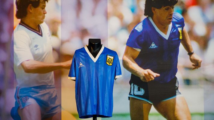 LONDON, ENGLAND - APRIL 20: Sotheby’s New Bond Street exhibition of Diego Maradona’s Historic 1986 World Cup Match-Worn Shirt opens to the public at Sotheby's on April 20, 2022 in London, England. The shirt was worn both during ‘The Hand of God’ and ‘Goal of the Century’ goals, as shown by Resolution Photomatching. The online auction opened this morning, with a first bid now placed on the lot for £4 million, bidding remains open until 4 May. (Photo by Tristan Fewings/Getty Images for Sotheby's) LONDON, ENGLAND - APRIL 20: Sotheby’s New Bond Street exhibition of Diego Maradona’s Historic 1986 World Cup Match-Worn Shirt opens to the public at Sotheby's on April 20, 2022 in London, England. The shirt was worn both during ‘The Hand of God’ and ‘Goal of the Century’ goals, as shown by Resolution Photomatching. The online auction opened this morning, with a first bid now placed on the lot for £4 million, bidding remains open until 4 May. (Photo by Tristan Fewings/Getty Images for Sotheby's)