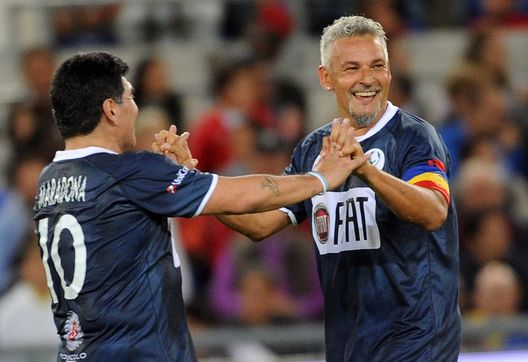 ROME, ITALY - SEPTEMBER 01: Roberto Baggio and Diego Maradona celebrate the goal during the Interreligious Match for Peace at Olimpico Stadium on September 1, 2014 in Rome, Italy. (Photo by Pier Marco Tacca/Getty Images) ROME, ITALY - SEPTEMBER 01: Roberto Baggio and Diego Maradona celebrate the goal during the Interreligious Match for Peace at Olimpico Stadium on September 1, 2014 in Rome, Italy. (Photo by Pier Marco Tacca/Getty Images)