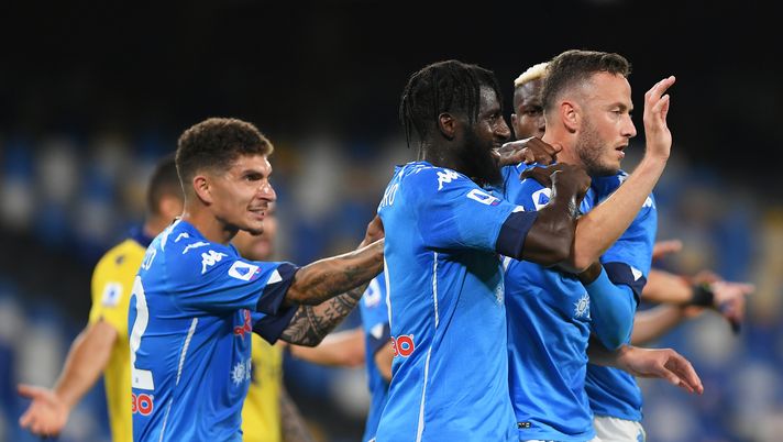 NAPLES, ITALY - MAY 23: Amir Rrahmani of SSC Napoli celebrates with team mates Tiemoue Bakayoko, Victor Osimhen and Giovanni Di Lorenzo after scoring his team's first goal during the Serie A match between SSC Napoli and Hellas Verona FC at Stadio Diego Armando Maradona on May 23, 2021 in Naples, Italy. Sporting stadiums around Italy remain under strict restrictions due to the Coronavirus Pandemic as Government social distancing laws prohibit fans inside venues resulting in games being played behind closed doors. (Photo by Francesco Pecoraro/Getty Images) NAPLES, ITALY - MAY 23: Amir Rrahmani of SSC Napoli celebrates with team mates Tiemoue Bakayoko, Victor Osimhen and Giovanni Di Lorenzo after scoring his team's first goal during the Serie A match between SSC Napoli and Hellas Verona FC at Stadio Diego Armando Maradona on May 23, 2021 in Naples, Italy. Sporting stadiums around Italy remain under strict restrictions due to the Coronavirus Pandemic as Government social distancing laws prohibit fans inside venues resulting in games being played behind closed doors. (Photo by Francesco Pecoraro/Getty Images)