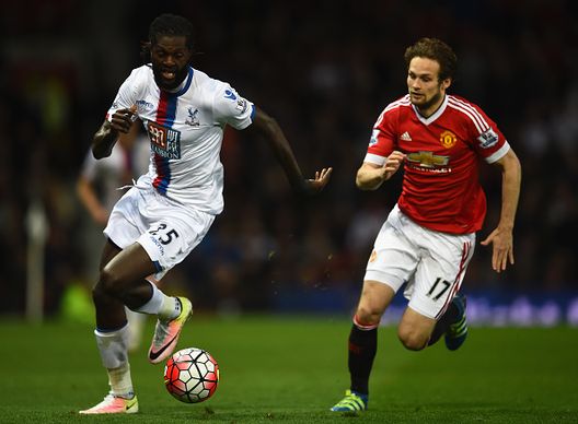 MANCHESTER, ENGLAND - APRIL 20:Emmanuel Adebayor of Crystal Palace is chased down by Daley Blind of Manchester United  during the Barclays Premier League match between Manchester United and Crystal Palace at Old Trafford on April 20, 2016 in Manchester, England.  (Photo by Laurence Griffiths/Getty Images) 