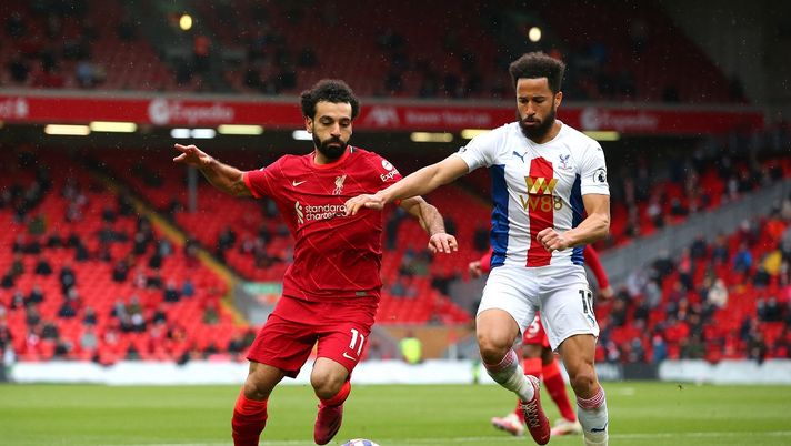 LIVERPOOL, ENGLAND - MAY 23: Mohamed Salah of Liverpool battles for possession with Andros Townsend of Crystal Palace during the Premier League match between Liverpool and Crystal Palace at Anfield on May 23, 2021 in Liverpool, England. A limited number of fans will be allowed into Premier League stadiums as Coronavirus restrictions begin to ease in the UK. (Photo by Alex Livesey/Getty Images) LIVERPOOL, ENGLAND - MAY 23: Mohamed Salah of Liverpool battles for possession with Andros Townsend of Crystal Palace during the Premier League match between Liverpool and Crystal Palace at Anfield on May 23, 2021 in Liverpool, England. A limited number of fans will be allowed into Premier League stadiums as Coronavirus restrictions begin to ease in the UK. (Photo by Alex Livesey/Getty Images)