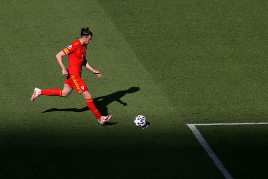 BAKU, AZERBAIJAN - JUNE 12: Gareth Bale of Wales takes a free kick during the UEFA Euro 2020 Championship Group A match between Wales and Switzerland at the Baku Olympic Stadium on June 12, 2021 in Baku, Azerbaijan. (Photo by Naomi Baker/Getty Images) BAKU, AZERBAIJAN - JUNE 12: Gareth Bale of Wales takes a free kick during the UEFA Euro 2020 Championship Group A match between Wales and Switzerland at the Baku Olympic Stadium on June 12, 2021 in Baku, Azerbaijan. (Photo by Naomi Baker/Getty Images)