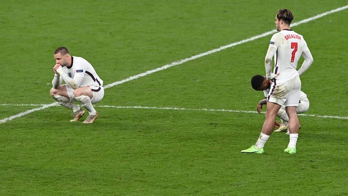 LONDON, ENGLAND - JULY 11: Luke Shaw, Raheem Sterling and Jack Grealish of England look dejected following their team's defeat in the UEFA Euro 2020 Championship Final between Italy and England at Wembley Stadium on July 11, 2021 in London, England. (Photo by Facundo Arrizabalaga - Pool/Getty Images) LONDON, ENGLAND - JULY 11: Luke Shaw, Raheem Sterling and Jack Grealish of England look dejected following their team's defeat in the UEFA Euro 2020 Championship Final between Italy and England at Wembley Stadium on July 11, 2021 in London, England. (Photo by Facundo Arrizabalaga - Pool/Getty Images)