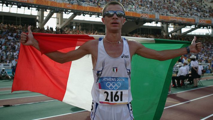 ATHENS - AUGUST 20:  Ivano Brugnetti of Italy celebrates after he won the men's 20 kilometre race walk on August 20, 2004 during the Athens 2004 Summer Olympic Games at the Olympic Stadium in the Sports Complex in Athens, Greece. (Photo by Michael Steele/Getty Images) 