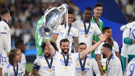 PARIS, FRANCE - MAY 28: Nacho Fernandez of Real Madrid lifts the UEFA Champions League trophy after their sides victory during the UEFA Champions League final match between Liverpool FC and Real Madrid at Stade de France on May 28, 2022 in Paris, France. (Photo by Shaun Botterill/Getty Images)