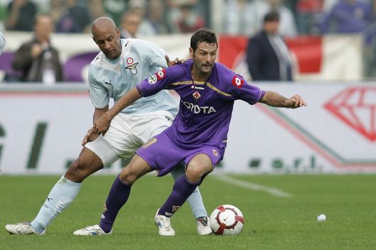 FLORENCE, ITALY - OCTOBER 04: Massimo Gobbi of ACF Fiorentina holds the ball up against Ousmane Dabo of Lazio during the Serie A match between ACF Fiorentina and S.S. Lazio held at the Stadio Artemio Franchi on October 4, 2009 in Florence, Italy. (Photo by Gabriele Maltinti/Getty Images) FLORENCE, ITALY - OCTOBER 04: Massimo Gobbi of ACF Fiorentina holds the ball up against Ousmane Dabo of Lazio during the Serie A match between ACF Fiorentina and S.S. Lazio held at the Stadio Artemio Franchi on October 4, 2009 in Florence, Italy. (Photo by Gabriele Maltinti/Getty Images)