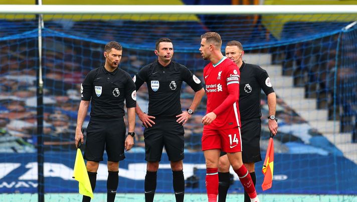 LIVERPOOL, ENGLAND - OCTOBER 17: Jordan Henderson of Liverpool speaks with Match Officials following the Premier League match between Everton and Liverpool at Goodison Park on October 17, 2020 in Liverpool, England. Sporting stadiums around the UK remain under strict restrictions due to the Coronavirus Pandemic as Government social distancing laws prohibit fans inside venues resulting in games being played behind closed doors. (Photo by Catherine Ivill/Getty Images) LIVERPOOL, ENGLAND - OCTOBER 17: Jordan Henderson of Liverpool speaks with Match Officials following the Premier League match between Everton and Liverpool at Goodison Park on October 17, 2020 in Liverpool, England. Sporting stadiums around the UK remain under strict restrictions due to the Coronavirus Pandemic as Government social distancing laws prohibit fans inside venues resulting in games being played behind closed doors. (Photo by Catherine Ivill/Getty Images)