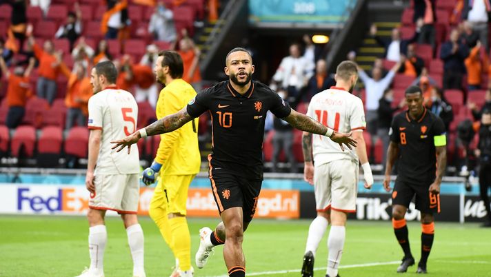 AMSTERDAM, NETHERLANDS - JUNE 21: Memphis Depay of Netherlands celebrates after scoring their side's first goal during the UEFA Euro 2020 Championship Group C match between North Macedonia and The Netherlands at Johan Cruijff Arena on June 21, 2021 in Amsterdam, Netherlands. (Photo by Piroshka van de Wouw - Pool/Getty Images) AMSTERDAM, NETHERLANDS - JUNE 21: Memphis Depay of Netherlands celebrates after scoring their side's first goal during the UEFA Euro 2020 Championship Group C match between North Macedonia and The Netherlands at Johan Cruijff Arena on June 21, 2021 in Amsterdam, Netherlands. (Photo by Piroshka van de Wouw - Pool/Getty Images)
