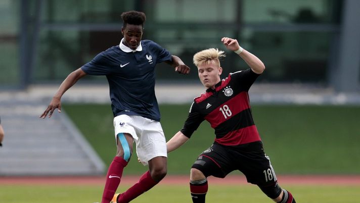VILA REAL DE SANTO ANTONIO, PORTUGAL - FEBRUARY 6: Charles Abi of France challenges Dominik Marx of Germany during the UEFA Under16 match between U16 France v U16 Germany on February 6, 2016 in Vila Real de Santo Antonio, Portugal. (Photo by Filipe Farinha/Bongarts/Getty Images) 