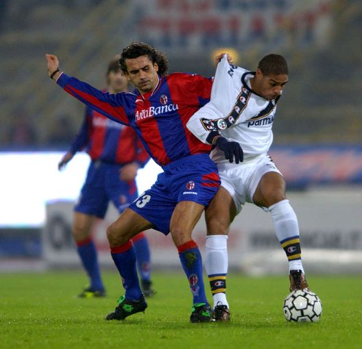 BOLOGNA - DECEMBER 14: Michele Paramatti of Bologna and Adriano of Parma in action during the Serie A match between Bologna and Parma, played at the Renato Dall'Arra Stadium, Bologna, Italy on December 14, 2002. (Photo by Grazia Neri/Getty Images) BOLOGNA - DECEMBER 14: Michele Paramatti of Bologna and Adriano of Parma in action during the Serie A match between Bologna and Parma, played at the Renato Dall'Arra Stadium, Bologna, Italy on December 14, 2002. (Photo by Grazia Neri/Getty Images)