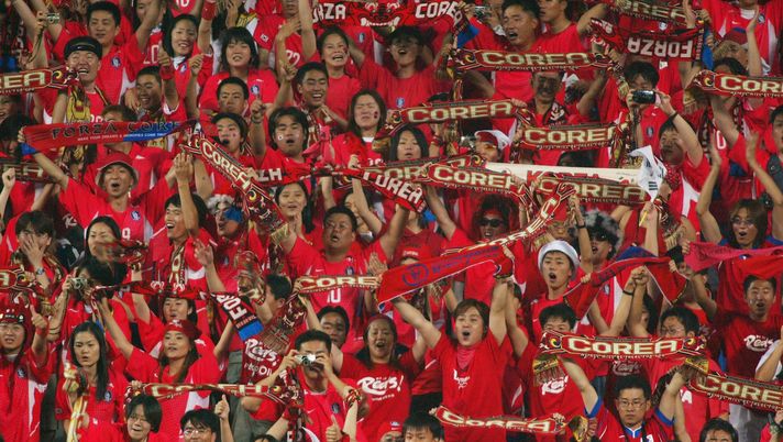 DAEJEON - JUNE 18: South Korea fans celebrate their teams 2-1 victory after the FIFA World Cup Finals 2002 Second Round match between South Korea and Italy played at the Daejeon World Cup Stadium, in Daejeon, South Korea on June 18, 2002. South Korea won the match 2-1 with a Golden Goal in extra-time. DIGITAL IMAGE. (Photo by Ben Radford/Getty Images) DAEJEON - JUNE 18: South Korea fans celebrate their teams 2-1 victory after the FIFA World Cup Finals 2002 Second Round match between South Korea and Italy played at the Daejeon World Cup Stadium, in Daejeon, South Korea on June 18, 2002. South Korea won the match 2-1 with a Golden Goal in extra-time. DIGITAL IMAGE. (Photo by Ben Radford/Getty Images)