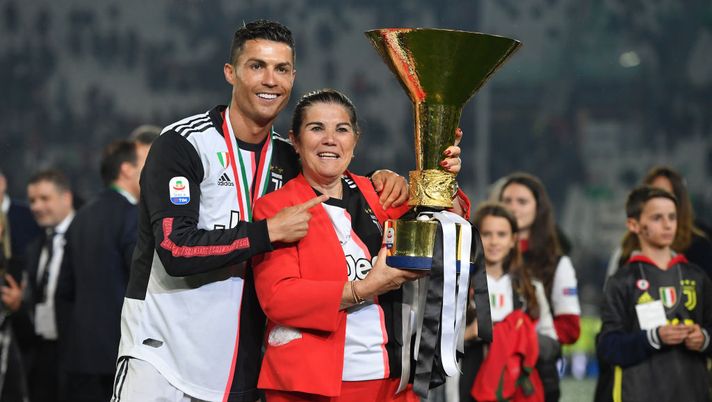 TURIN, ITALY - MAY 19: Cristiano Ronaldo (L) of Juventus celebrates with his mother Maria Dolores Aveiro during the awards ceremony after winning the Serie A Championship during the Serie A match between Juventus and Atalanta BC on May 19, 2019 in Turin, Italy. (Photo by Tullio M. Puglia/Getty Images) TURIN, ITALY - MAY 19: Cristiano Ronaldo (L) of Juventus celebrates with his mother Maria Dolores Aveiro during the awards ceremony after winning the Serie A Championship during the Serie A match between Juventus and Atalanta BC on May 19, 2019 in Turin, Italy. (Photo by Tullio M. Puglia/Getty Images)