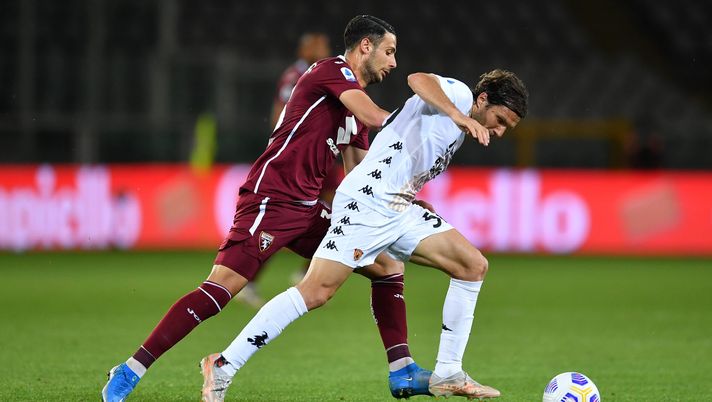 TURIN, ITALY - MAY 23: Perparim Hetemaj of Benevento Calcio battles for possession with Rolando Mandragora of Torino FC during the Serie A match between Torino FC v Benevento Calcio at Olimpico Stadium on May 23, 2021 in Turin, Italy. Sporting stadiums around Italy remain under strict restrictions due to the Coronavirus Pandemic as Government social distancing laws prohibit fans inside venues resulting in games being played behind closed doors. (Photo by Valerio Pennicino/Getty Images) TURIN, ITALY - MAY 23: Perparim Hetemaj of Benevento Calcio battles for possession with Rolando Mandragora of Torino FC during the Serie A match between Torino FC v Benevento Calcio at Olimpico Stadium on May 23, 2021 in Turin, Italy. Sporting stadiums around Italy remain under strict restrictions due to the Coronavirus Pandemic as Government social distancing laws prohibit fans inside venues resulting in games being played behind closed doors. (Photo by Valerio Pennicino/Getty Images)