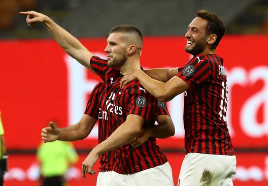 MILAN, ITALY - JULY 07: Ante Rebic (L) of AC Milan celebrates his goal with his team-mate Hakan Calhanoglu (R) aduring the Serie A match between AC Milan and Juventus at Stadio Giuseppe Meazza on July 7, 2020 in Milan, Italy. (Photo by Marco Luzzani/Getty Images) MILAN, ITALY - JULY 07: Ante Rebic (L) of AC Milan celebrates his goal with his team-mate Hakan Calhanoglu (R) aduring the Serie A match between AC Milan and Juventus at Stadio Giuseppe Meazza on July 7, 2020 in Milan, Italy. (Photo by Marco Luzzani/Getty Images)