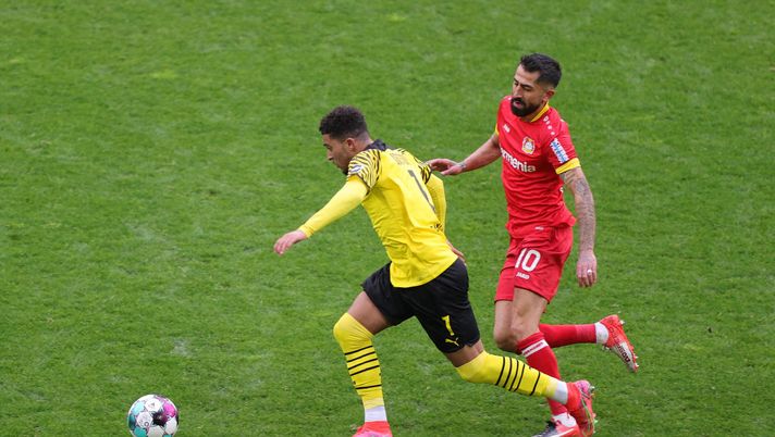 DORTMUND, GERMANY - MAY 22: Jadon Sancho of Borussia Dortmund is put under pressure by Kerem Demirbay of Bayer Leverkusen during the Bundesliga match between Borussia Dortmund and Bayer 04 Leverkusen at Signal Iduna Park on May 22, 2021 in Dortmund, Germany. Sporting stadiums around Germany remain under strict restrictions due to the Coronavirus Pandemic as Government social distancing laws prohibit fans inside venues resulting in games being played behind closed doors. (Photo by Friedemann Vogel - Pool/Getty Images) DORTMUND, GERMANY - MAY 22: Jadon Sancho of Borussia Dortmund is put under pressure by Kerem Demirbay of Bayer Leverkusen during the Bundesliga match between Borussia Dortmund and Bayer 04 Leverkusen at Signal Iduna Park on May 22, 2021 in Dortmund, Germany. Sporting stadiums around Germany remain under strict restrictions due to the Coronavirus Pandemic as Government social distancing laws prohibit fans inside venues resulting in games being played behind closed doors. (Photo by Friedemann Vogel - Pool/Getty Images)