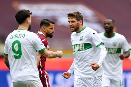 TURIN, ITALY - MARCH 17: Domenico Berardi of Sassuolo celebrates with Francesco Caputo after scoring his sides first goal during the Serie A match between Torino FC and US Sassuolo at Stadio Olimpico di Torino on March 17, 2021 in Turin, Italy. Sporting stadiums around Italy remain under strict restrictions due to the Coronavirus Pandemic as Government social distancing laws prohibit fans inside venues resulting in games being played behind closed doors. (Photo by Valerio Pennicino/Getty Images) TURIN, ITALY - MARCH 17: Domenico Berardi of Sassuolo celebrates with Francesco Caputo after scoring his sides first goal during the Serie A match between Torino FC and US Sassuolo at Stadio Olimpico di Torino on March 17, 2021 in Turin, Italy. Sporting stadiums around Italy remain under strict restrictions due to the Coronavirus Pandemic as Government social distancing laws prohibit fans inside venues resulting in games being played behind closed doors. (Photo by Valerio Pennicino/Getty Images)
