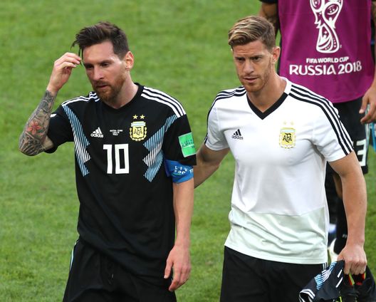 MOSCOW, RUSSIA - JUNE 16: Lionel Messi of Argentina is consoled by team mate Cristian Ansaldi during the 2018 FIFA World Cup Russia group D match between Argentina and Iceland at Spartak Stadium on June 16, 2018 in Moscow, Russia. (Photo by Clive Rose/Getty Images) MOSCOW, RUSSIA - JUNE 16: Lionel Messi of Argentina is consoled by team mate Cristian Ansaldi during the 2018 FIFA World Cup Russia group D match between Argentina and Iceland at Spartak Stadium on June 16, 2018 in Moscow, Russia. (Photo by Clive Rose/Getty Images)