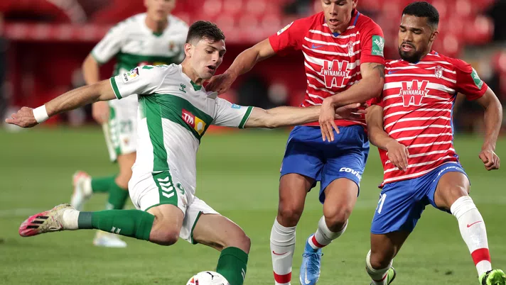 GRANADA, SPAIN - FEBRUARY 28: Lucas Boye of Elche CF scores their side's first goal during the La Liga Santander match between Granada CF and Elche CF at Estadio Nuevo Los Carmenes on February 28, 2021 in Granada, Spain. Sporting stadiums around Spain remain under strict restrictions due to the Coronavirus Pandemic as Government social distancing laws prohibit fans inside venues resulting in games being played behind closed doors. (Photo by Gonzalo Arroyo Moreno/Getty Images)