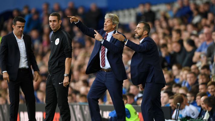 LIVERPOOL, ENGLAND - SEPTEMBER 16: Manuel Pellegrini, Manager of West Ham United, and West Ham United Assistant Coach, Enzo Maresca give their team instructions during the Premier League match between Everton FC and West Ham United at Goodison Park on September 16, 2018 in Liverpool, United Kingdom. (Photo by Stu Forster/Getty Images) LIVERPOOL, ENGLAND - SEPTEMBER 16: Manuel Pellegrini, Manager of West Ham United, and West Ham United Assistant Coach, Enzo Maresca give their team instructions during the Premier League match between Everton FC and West Ham United at Goodison Park on September 16, 2018 in Liverpool, United Kingdom. (Photo by Stu Forster/Getty Images)