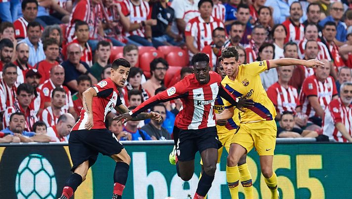 BILBAO, SPAIN - AUGUST 16: Inaki Williams of Athletic Club (C) competes for the ball with Sergi Roberto of FC Barcelona (R) during the Liga match between Athletic Club and FC Barcelona at San Mames Stadium on August 16, 2019 in Bilbao, Spain. (Photo by Juan Manuel Serrano Arce/Getty Images) BILBAO, SPAIN - AUGUST 16: Inaki Williams of Athletic Club (C) competes for the ball with Sergi Roberto of FC Barcelona (R) during the Liga match between Athletic Club and FC Barcelona at San Mames Stadium on August 16, 2019 in Bilbao, Spain. (Photo by Juan Manuel Serrano Arce/Getty Images)