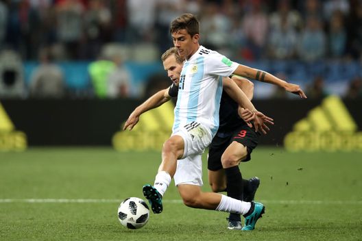 NIZHNY NOVGOROD, RUSSIA - JUNE 21: Paulo Dybala of Argentina holds off Andrej Kramaric of Croatia during the 2018 FIFA World Cup Russia group D match between Argentina and Croatia at Nizhny Novgorod Stadium on June 21, 2018 in Nizhny Novgorod, Russia. (Photo by Clive Brunskill/Getty Images)