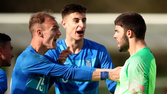 BURTON-UPON-TRENT, ENGLAND - MARCH 23:  Apostolos Diamantis (L) and during Giorgos Antzoulas congratulate goalkeeper Ioannis Nikopolidis after he saves a penalty  the UEFA U19 Championship Qualifier between Greece U19 and England U19 at St Georges Park on March 23, 2019 in Burton-upon-Trent, England. (Photo by Marc Atkins/Getty Images) 