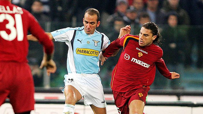 ROME - JANUARY 6: Di Canio of Lazio is challenged by Cufre of Roma during the Serie A match between Lazio and Roma at the Olympic Stadium January 6, 2005 in Rome, Italy. (Photo by New Press/Getty Images) ROME - JANUARY 6: Di Canio of Lazio is challenged by Cufre of Roma during the Serie A match between Lazio and Roma at the Olympic Stadium January 6, 2005 in Rome, Italy. (Photo by New Press/Getty Images)